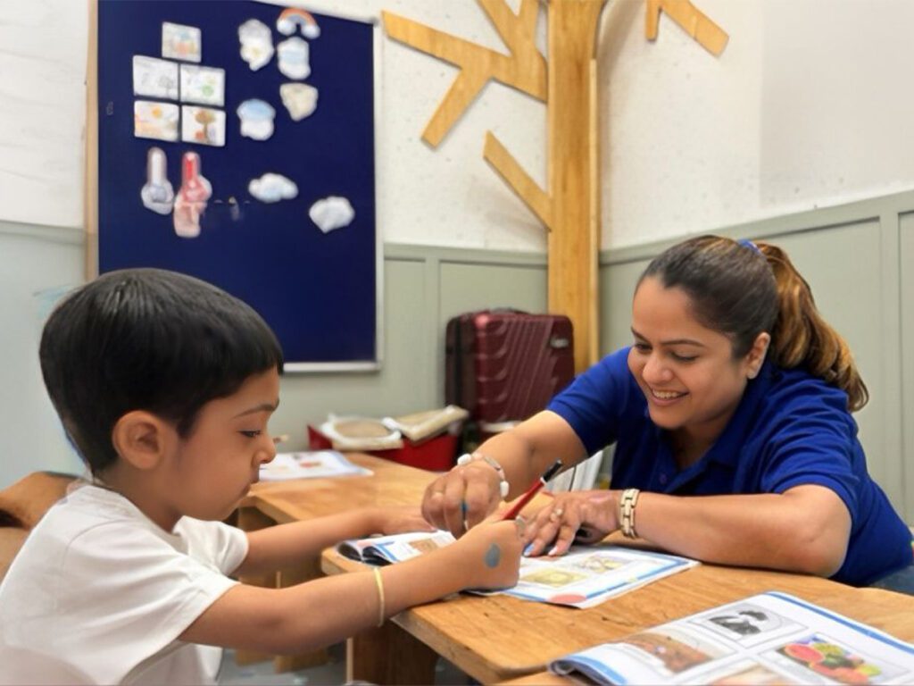 Teacher guiding child in AI-integrated hands-on brain development activity at ThinkRight learning centre
