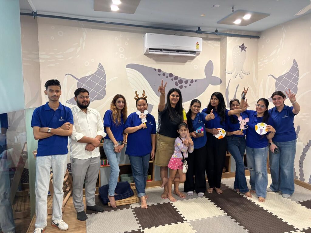 ThinkRight team in whale-themed classroom promoting creative early childhood learning activities.